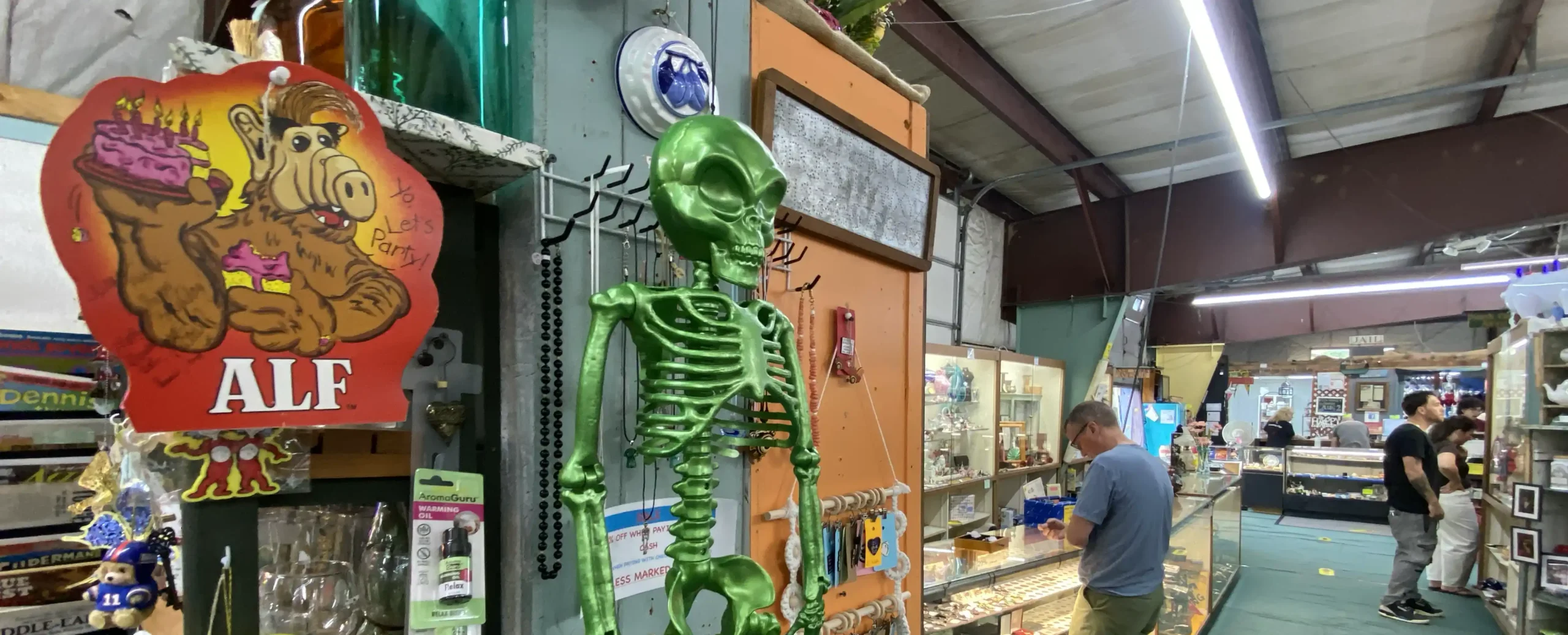 Interior booths displaying antiques and vintage items at Scranberry Coop in Andover, New Jersey
